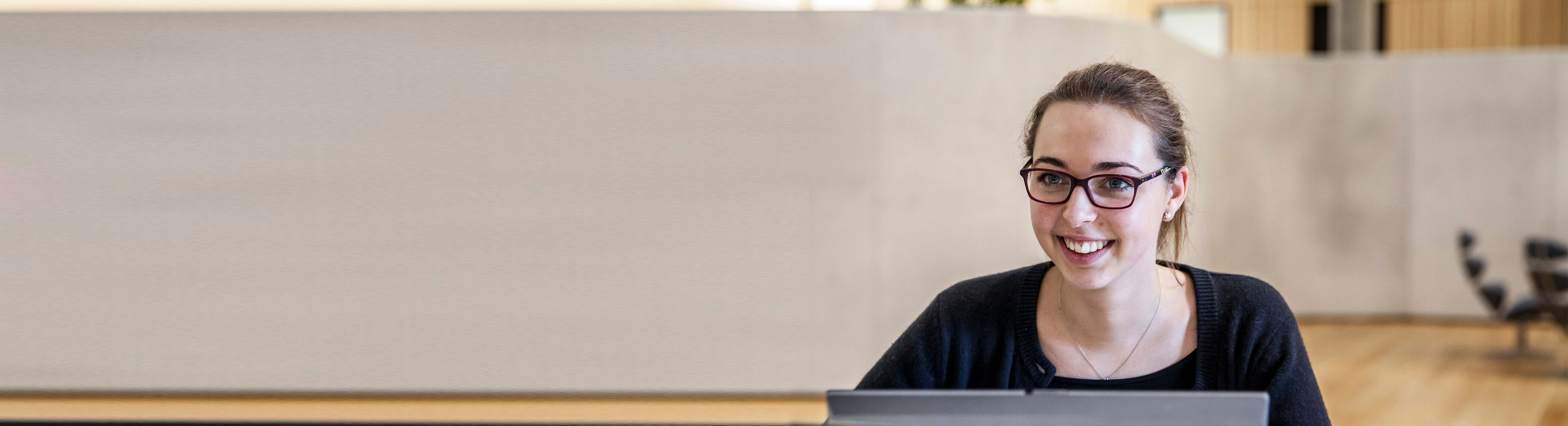 Female young DSV trainee working on her laptop